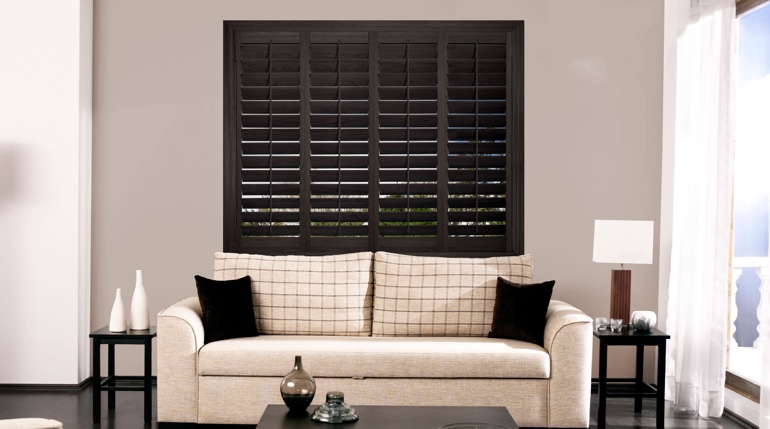 Austin sunroom with black shutters.